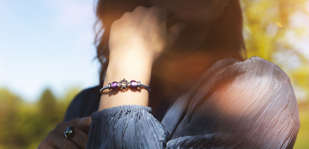 Silver bangle with gemstones